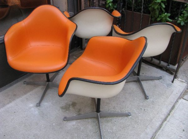 Set of Four Eames Orange Upholstered Arm Shell Swivel Chairs