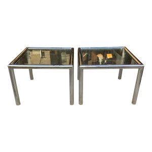 Pair of "Tubo" side tables by John Mascheroni. Constructed of beautifully welded polished aluminum 2 1/2" cylinders with 3/8" glass that floats within the frame. Tables retain their adjustable, self leveling glides.