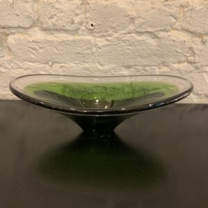 Mid-century aqua blue glass curved bowl by Per Lutken for Holmegaard of Denmark. A flat base and circular form features curved wave-like rounded edges. Handblown in Aqua grey glass with variances in color. Signed and excellent condition