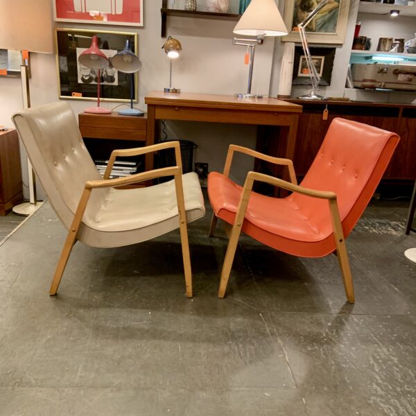 Early pair of Milo Baughman signed scoop lounge chairs with light walnut frames. Original orange vinyl